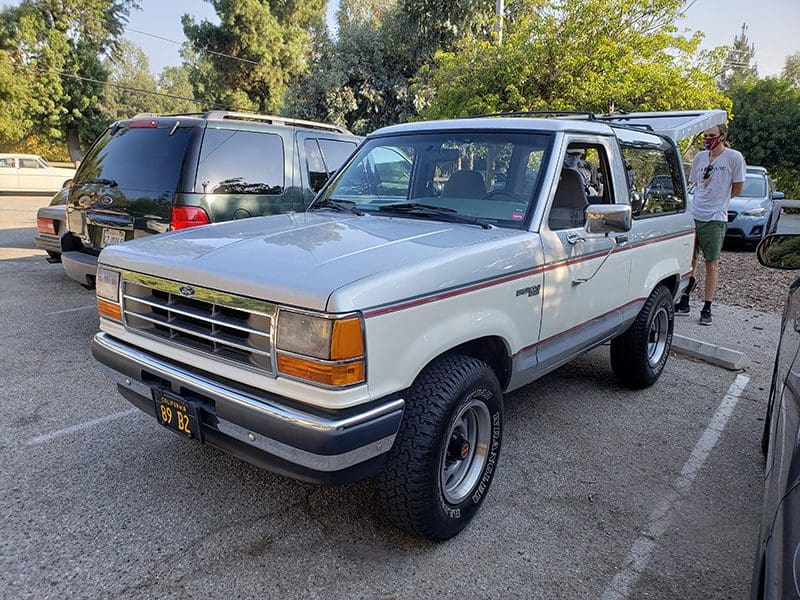 Classic white Ford SUV parked outdoors with vintage styling.