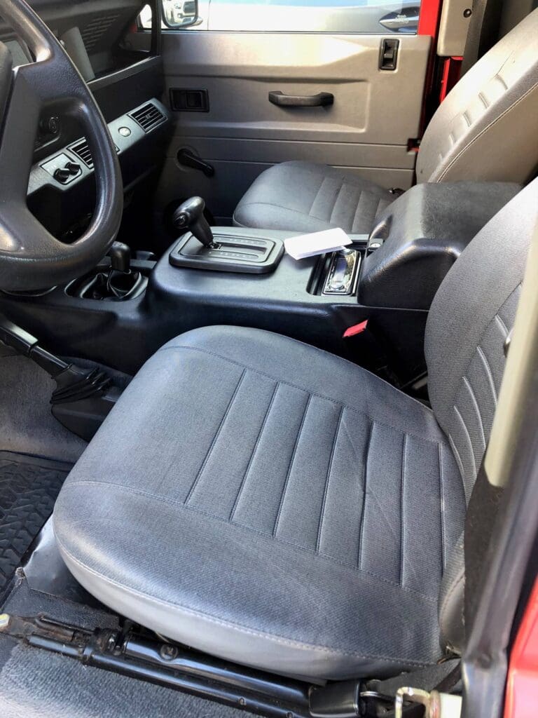 Interior view of a car showing the front seats and center console.