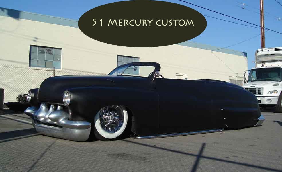 Black 1951 Mercury Custom convertible parked outdoors.