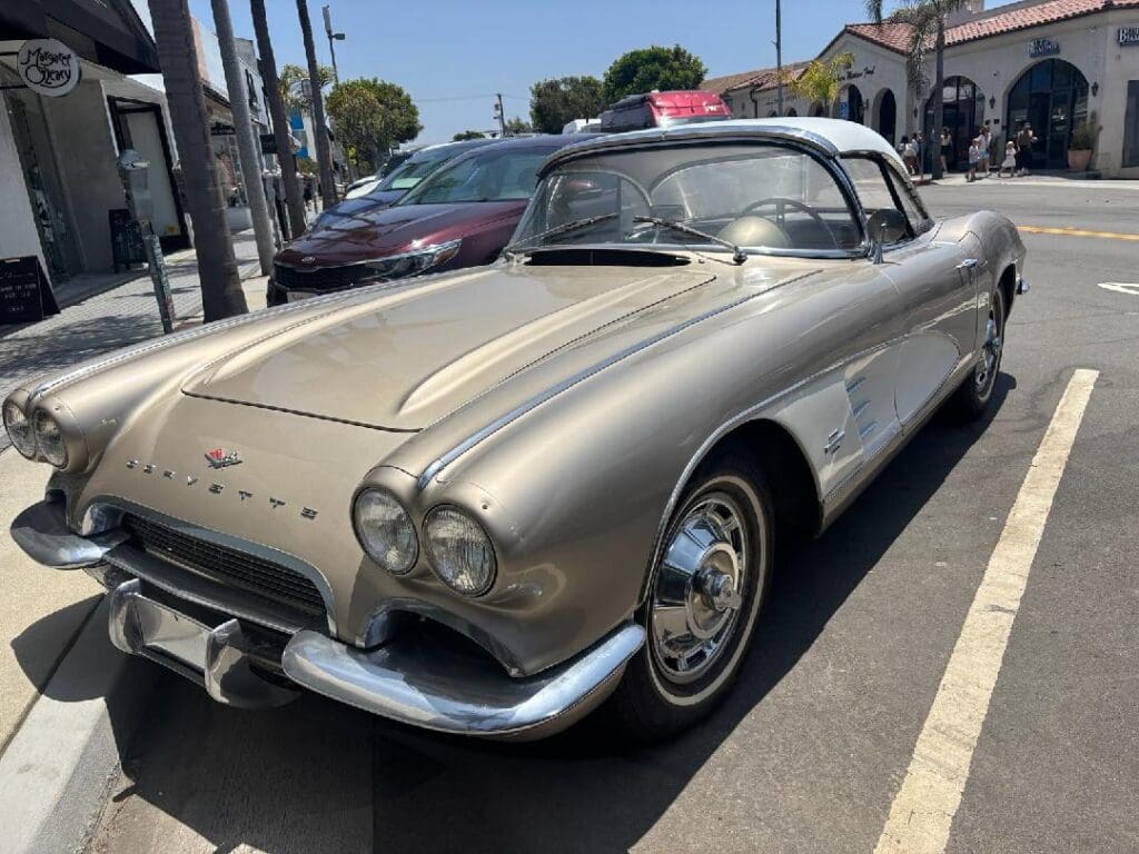 Classic beige Chevrolet Corvette parked on a sunny street.