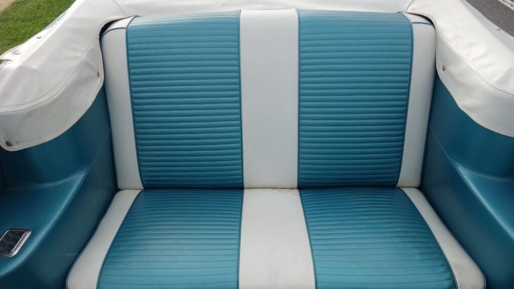 Blue and white striped cushioned seat with retro design.