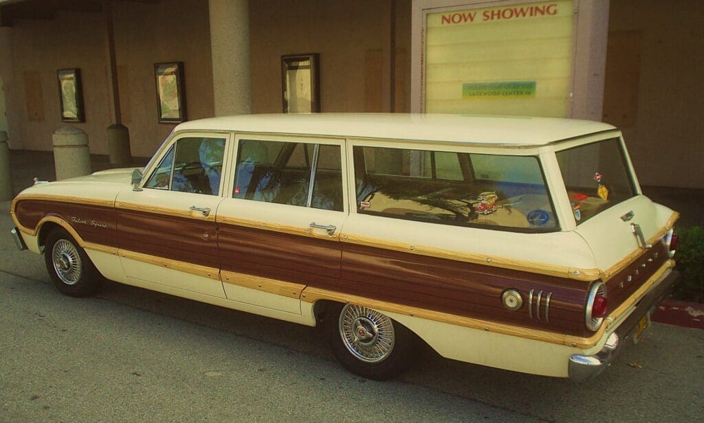 Vintage wood-paneled station wagon parked indoors.
