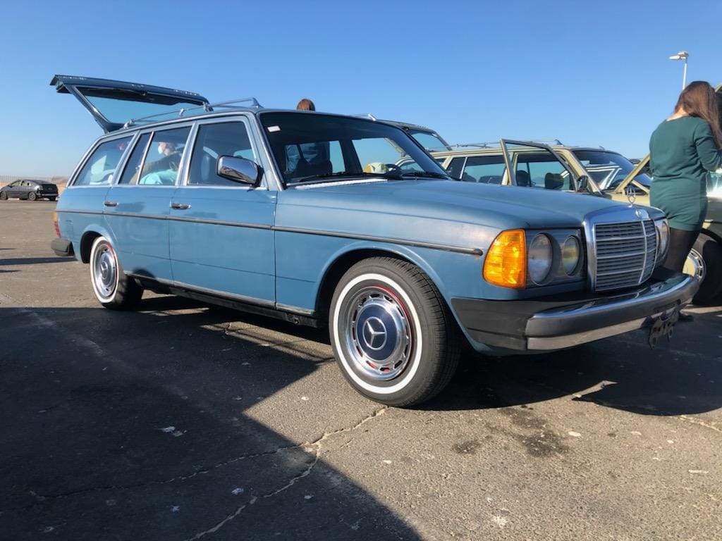 Classic blue Mercedes-Benz station wagon parked outdoors.