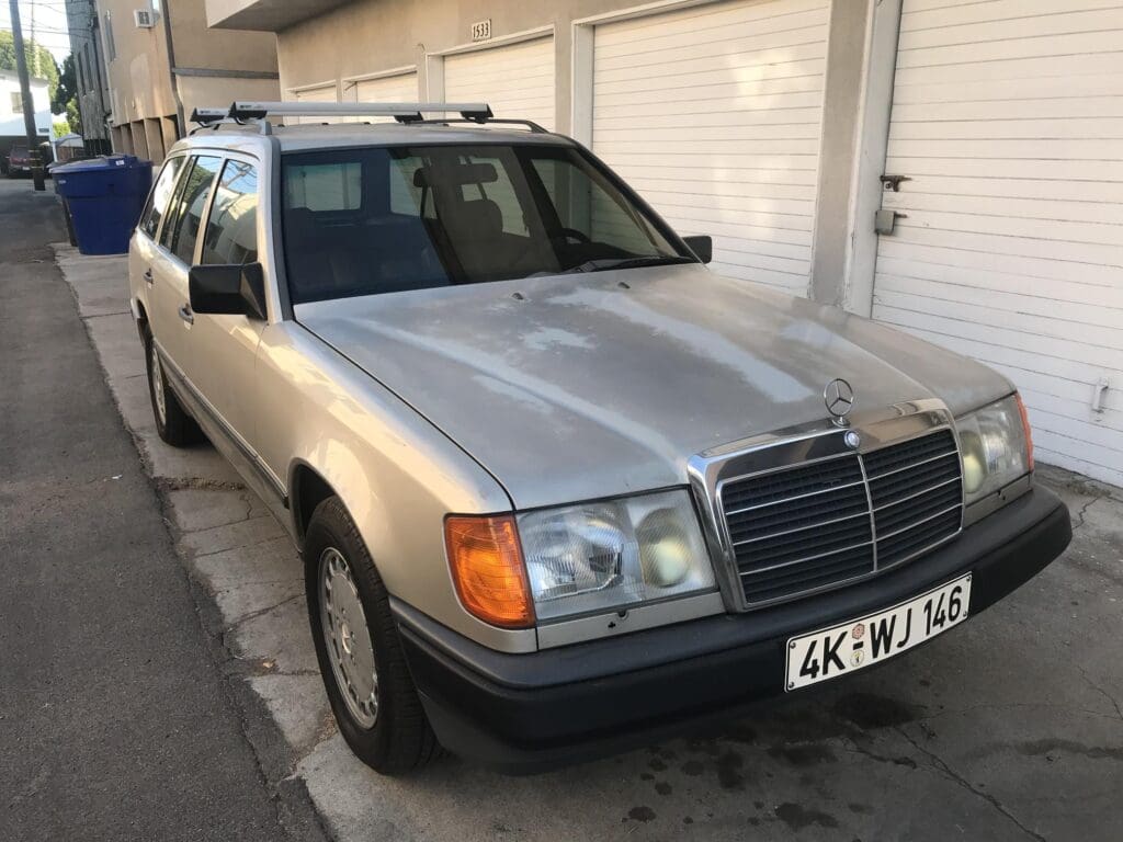 Silver Mercedes-Benz station wagon parked in a driveway.