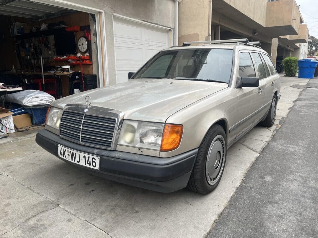 Silver Mercedes-Benz station wagon parked in a driveway.