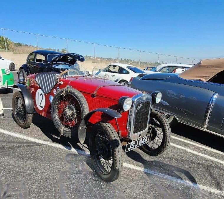 Vintage red race car with number 10 on the side.