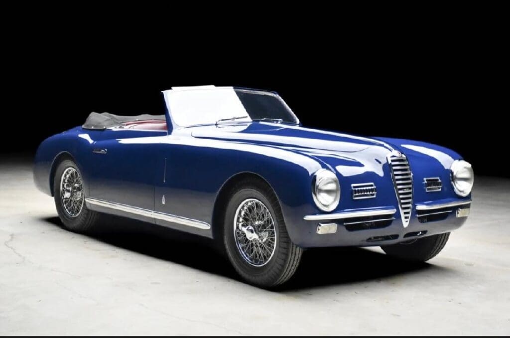 Classic blue convertible car with sleek design and chrome accents.