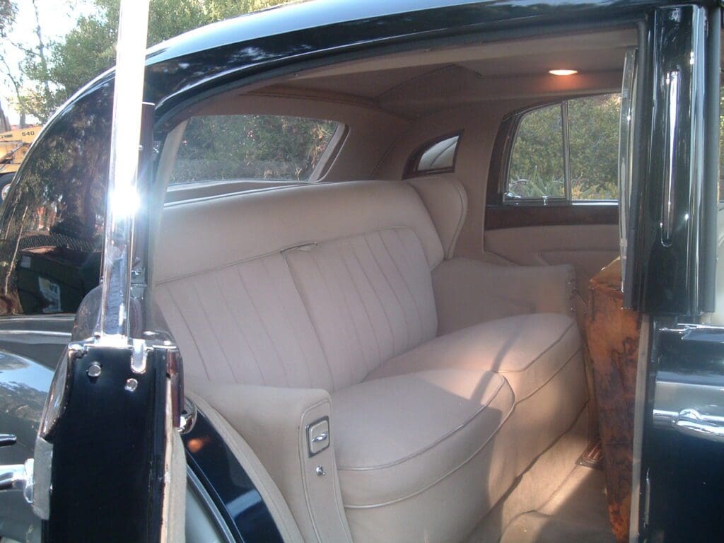Luxurious beige leather interior of a classic car.