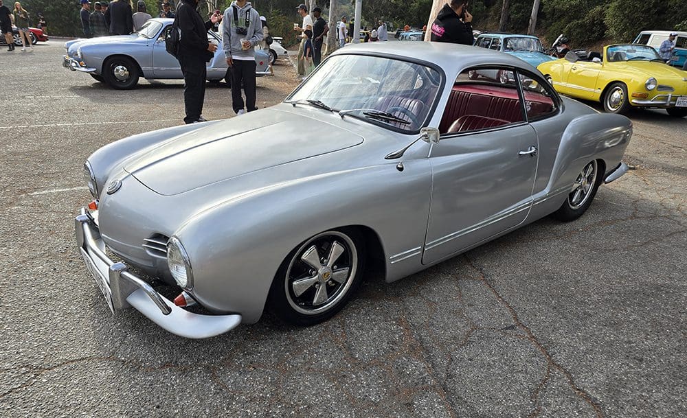 Classic silver vintage car with sleek design and polished rims.