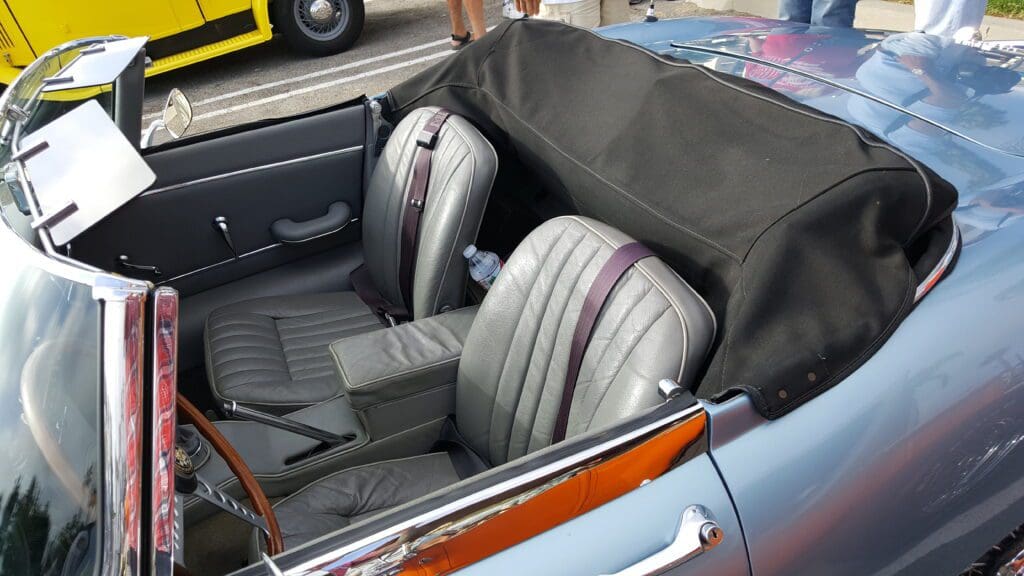 Interior of a classic convertible car with black and gray seats.