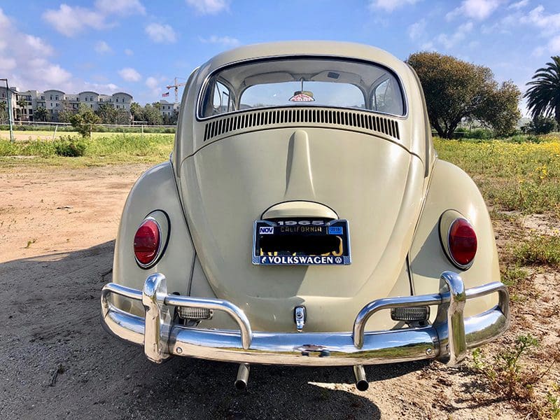 Classic vintage Volkswagen Beetle parked on a sunny day.