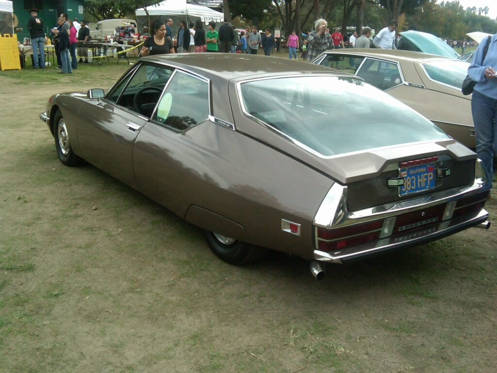 Classic vintage car displayed at an outdoor event.