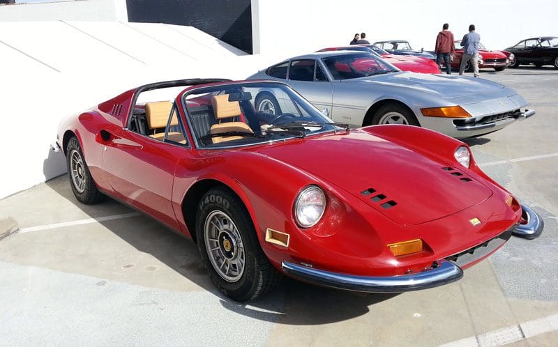 Classic red sports car with sleek design and pop-up headlights.