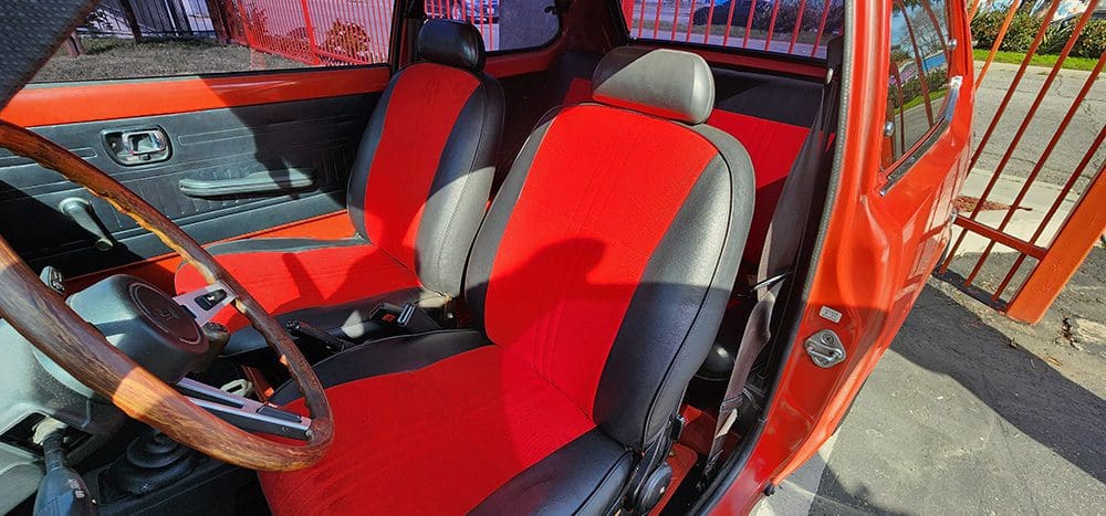 Bright red and black car seats with a sporty design.