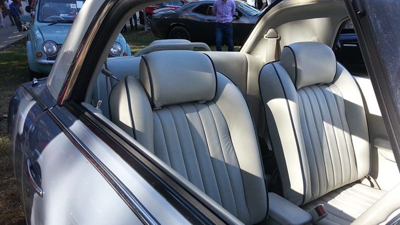 Luxurious leather car seats with elegant stitching and headrests.