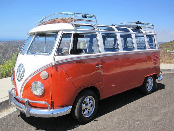 Vintage red and white VW camper van.