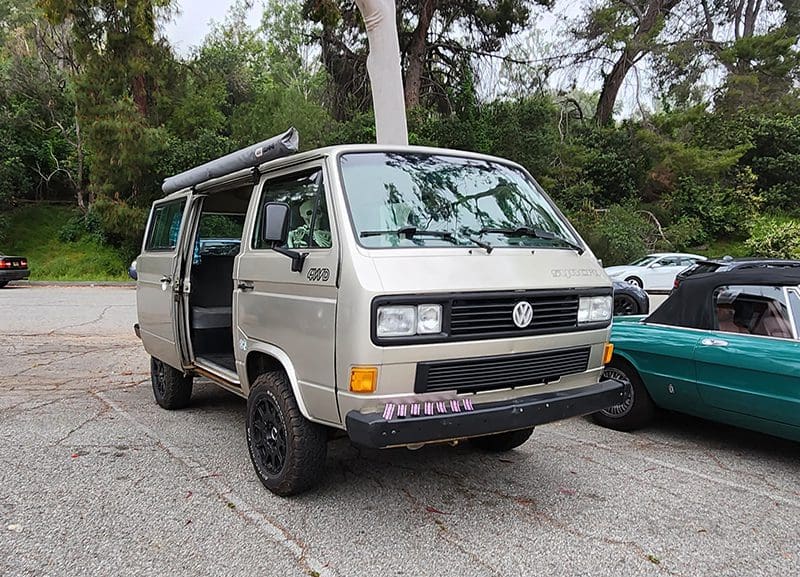 Vintage Volkswagen van parked in nature.