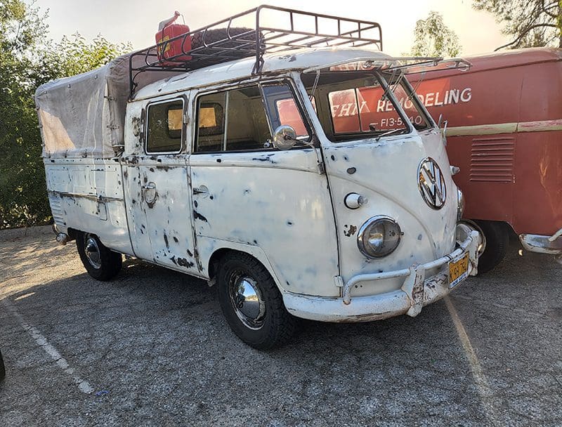 Vintage Volkswagen van with roof rack.
